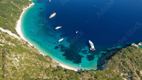 Aerial drone photo of beautiful paradise steep cliff sandy beach of Gidaki accessible by short hiking in beautiful Ionian island of Ithaki or Ithaca, Greece