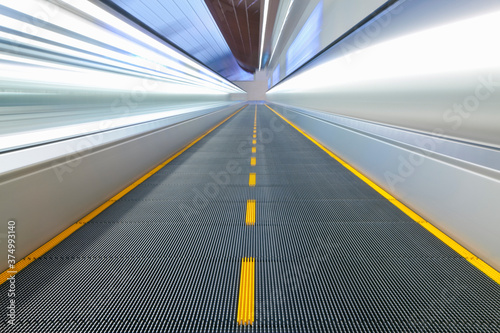 View along a moving walkway in Dubai International Airport, Dubai, United Arab Emirates, UAE