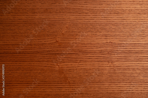 The structure of natural ash wood, tinted oak. Hardwood. Creative vintage background. Imitation of aging.