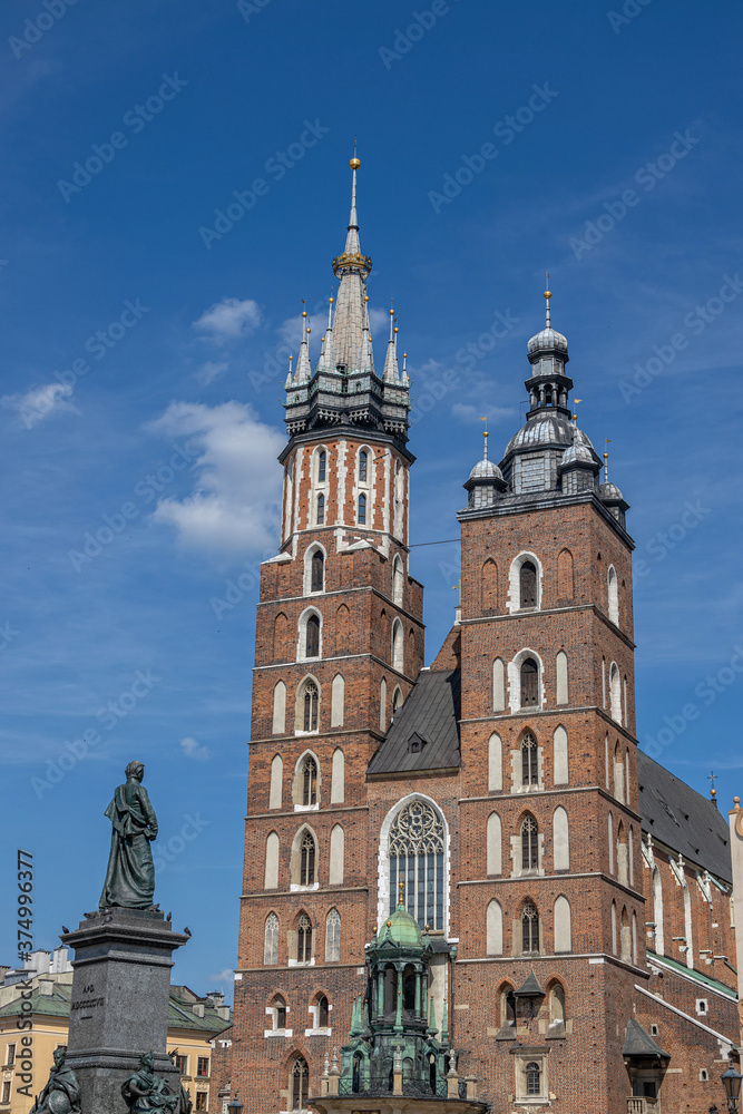 historic church in the old town square in krakow, poland on a summer holiday day