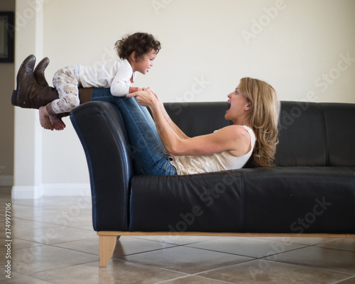 a mother playing with her son photo