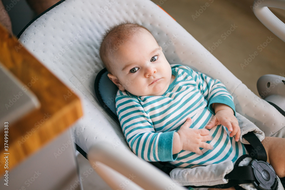 Baby three months old in the seat lounger and swing Baby three months old in the seat lounger and swing