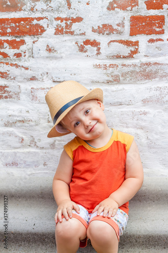 Portrait of a boy in a hat. A child poses in a beautiful hat.