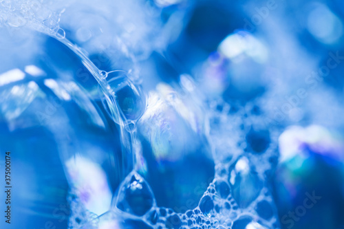 Macro of sudsy bubbles in blue