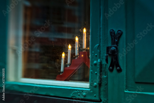 Christmas lights on a window sill in Sweden photo