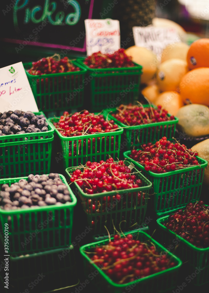 Pints of berries at the farmer's market. Pints of berries at the farmer's market.