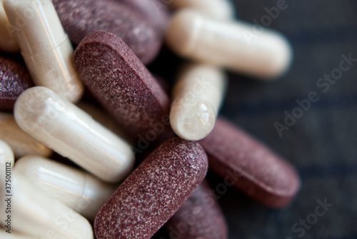 white and redish pills photo