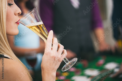 Casino: High Roller Takes Sip Of Champagne In Casino