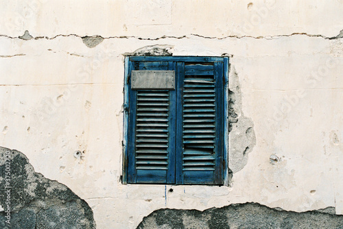 Blue shuttered window in Santorini, Greece