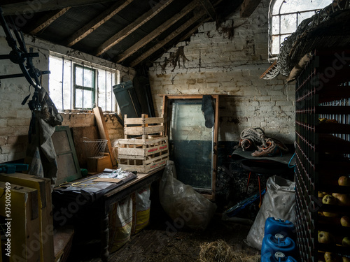 Annex room of a farmhouse containing apples and miscellaneous equipment