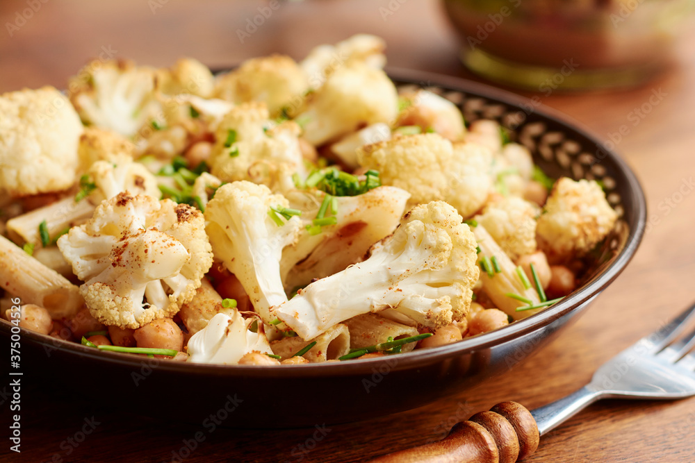 Spicy Roasted Cauliflower And Chickpeas on Penne Pasta Spicy Roasted Cauliflower And Chickpeas on Penne Pasta