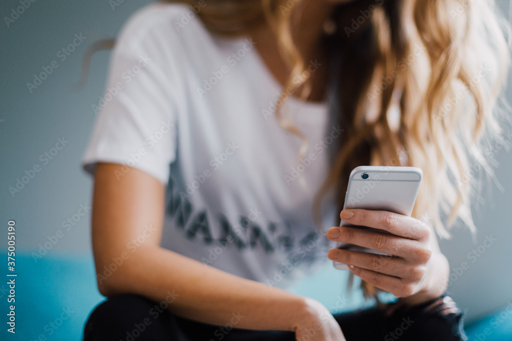 Woman Using a Mobile Phone at Home Woman Using a Mobile Phone at Home