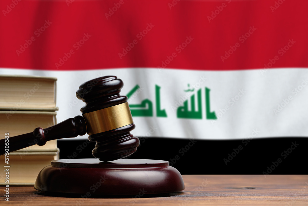 Justice and court concept in Republic of Iraq. Judge hammer on a flag background