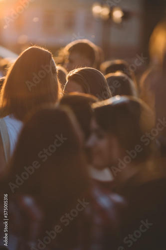 a lot of young people on the street photo