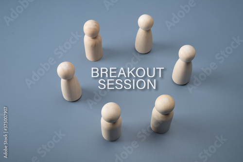 Breakout session concept. Wooden figure circle with text.