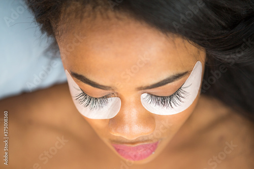 Closeup of an African-American woman with eyelash extensions photo