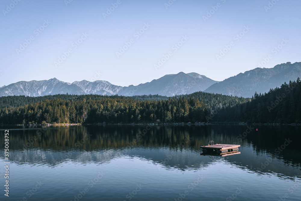 Lake Eibsee in Garmisch-Partenkirchen area at sunrise. Concept for landscape, background and wallpaper, Alps and  tourism, stand up paddle, hiking, swimming, holidays