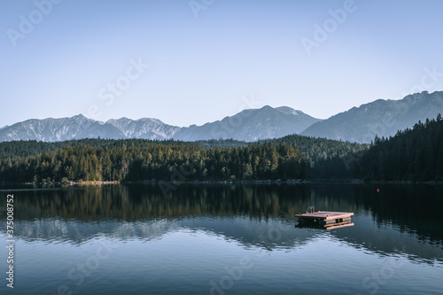 Lake Eibsee in Garmisch-Partenkirchen area at sunrise. Concept for landscape, background and wallpaper, Alps and tourism, stand up paddle, hiking, swimming, holidays