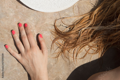 wet hair hat and hand summertime composition