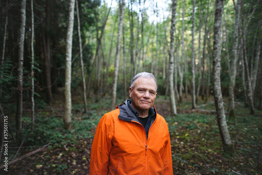 A peacefule, retired age man spending solitude in the forest. A peacefule, retired age man spending solitude in the forest.