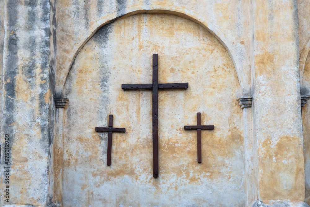 old wooden cross on the wall