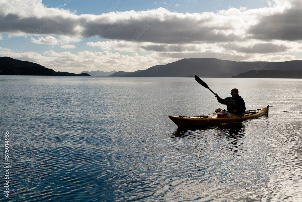 Silhouette of a female paddler, New Zealand.