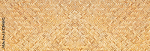 Traditional handcraft woven bamboo texture for banner, weave wood pattern background.