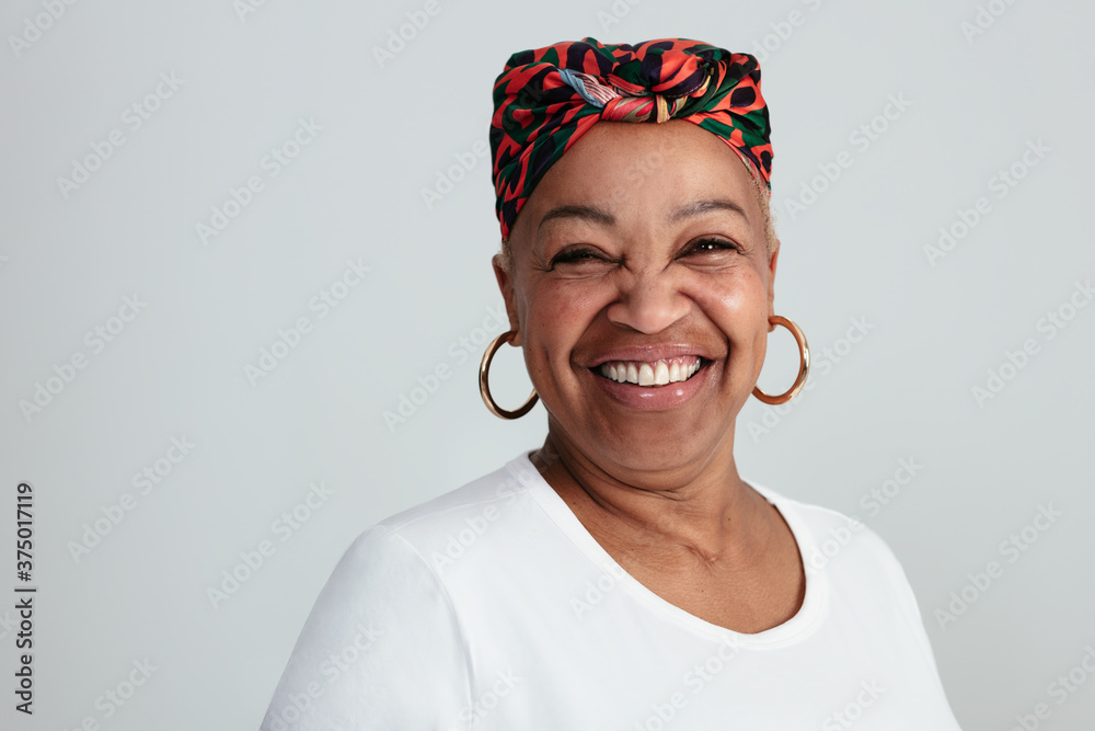© BONNINSTUDIO/Stocksy - Happy Adult Ethnic Woman Looking At Camera © BONNINSTUDIO/Stocksy - Happy Adult Ethnic Woman Looking At Camera