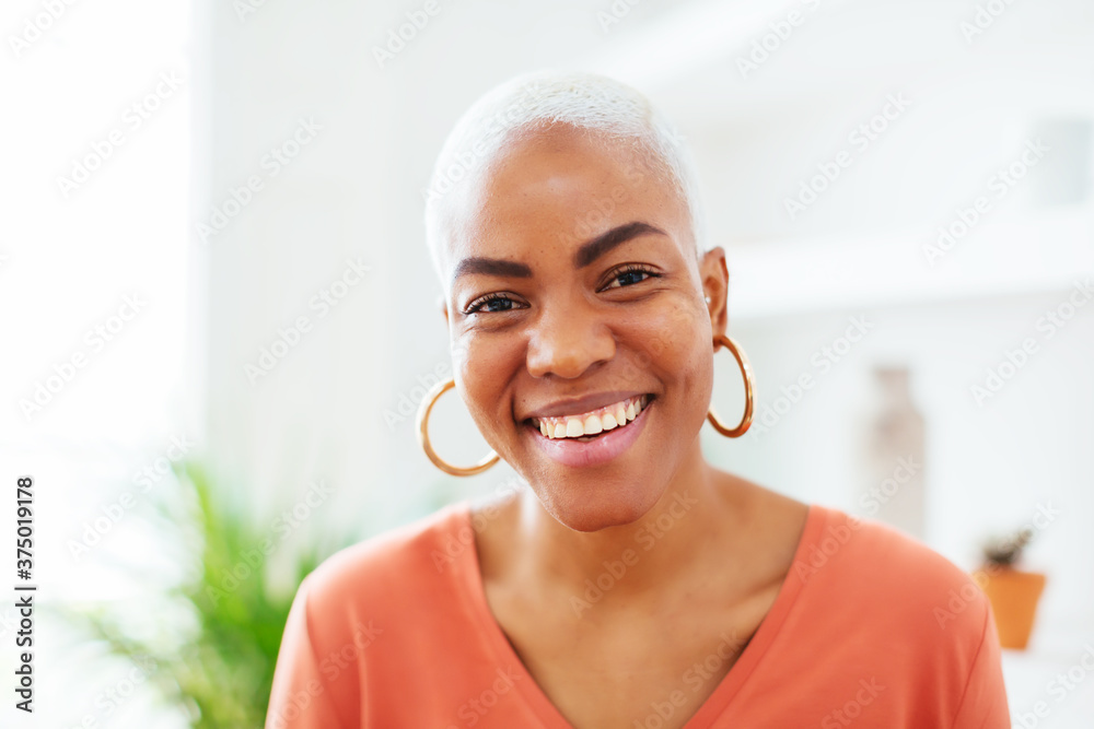 Positive African American woman smiling for camera Positive African American woman smiling for camera