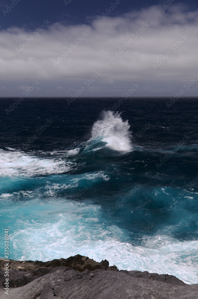 North coast of Gran Canaria, Canary Islands, Banaderos area, strangely shaped wave, resembling underwater explosion, 
formed by a clash of incoming and reflected waves