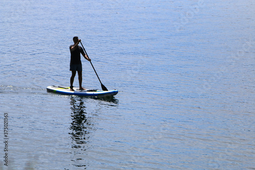 Paddle boarding in mountain lake  © Cody