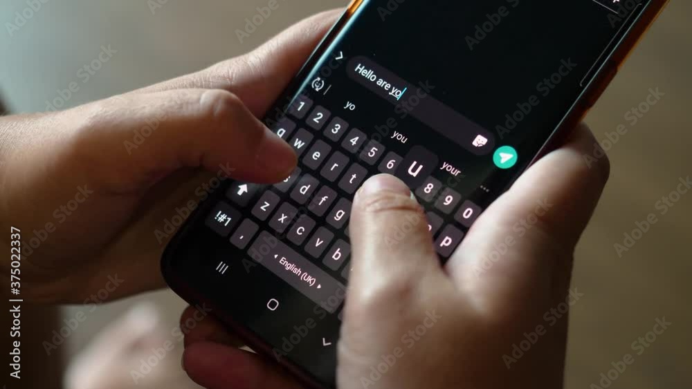 Person writing an SMS to a friend. Person writing an SMS to a friend.