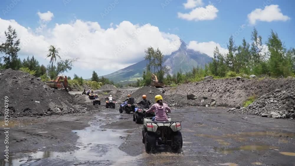 Atv In Bicol Eye level shot of people riding quad bike atv in Bicol Philippines with ...