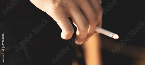 man holding a cigarette