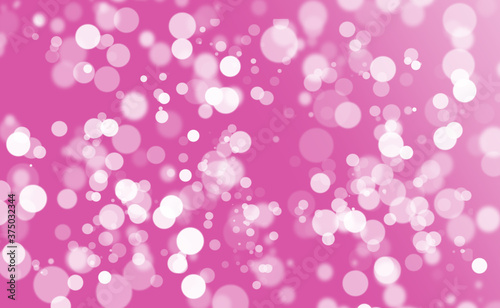 Abstract glitter bokeh on pink-purple background.