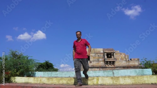 man at Vadatalav lake. man enjoying nature and pavagadh mountain photo