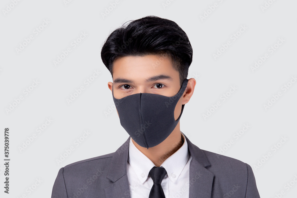 Portrait young asian businessman in suit wearing face mask for protective covid-19 isolated on white background, medical mask and healthcare, impact and quarantine for pandemic coronavirus. Portrait young asian businessman in suit wearing face mask for protective covid-19 isolated on white background, medical mask and healthcare, impact and quarantine for pandemic coronavirus.