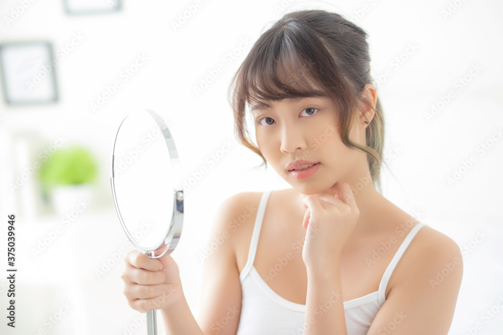 Beautiful face young asian woman with happy smiling and looking mirror, makeup of beauty facial girl with skincare and cosmetic treatment, refresh of female and clean for charming, healthy concept. Beautiful face young asian woman with happy smiling and looking mirror, makeup of beauty facial girl with skincare and cosmetic treatment, refresh of female and clean for charming, healthy concept.
