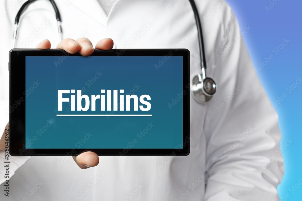 Fibrillins. Doctor holds a tablet computer in his hand. Close up. Text is on the display. Blue Background Fibrillins. Doctor holds a tablet computer in his hand. Close up. Text is on the display. Blue Background