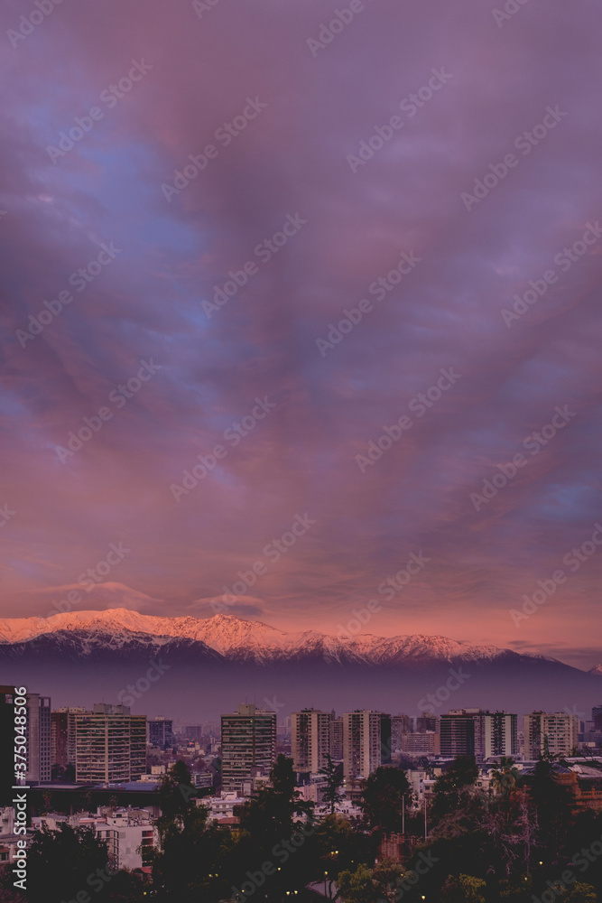 Scenic view of beautiful clouds and sunset sky over Santiago and The Andes Mountains, Chile	