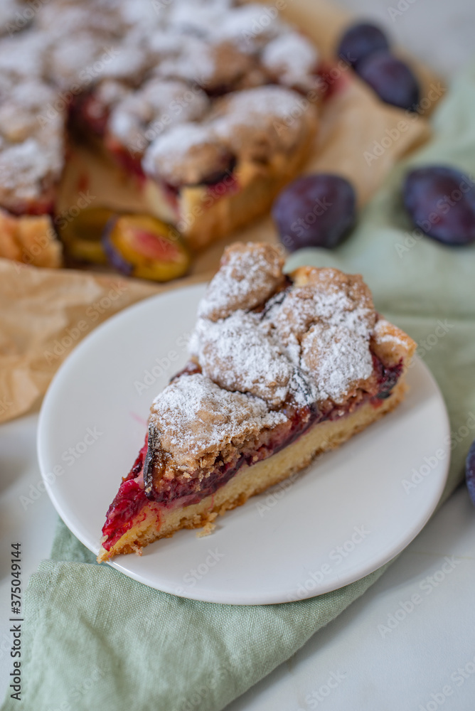 sweet home made plum crumble pie on a table sweet home made plum crumble pie on a table