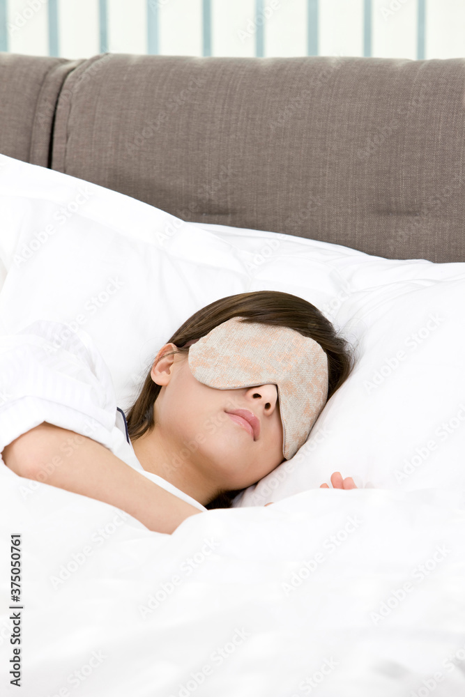 young woman wearing an eye mask