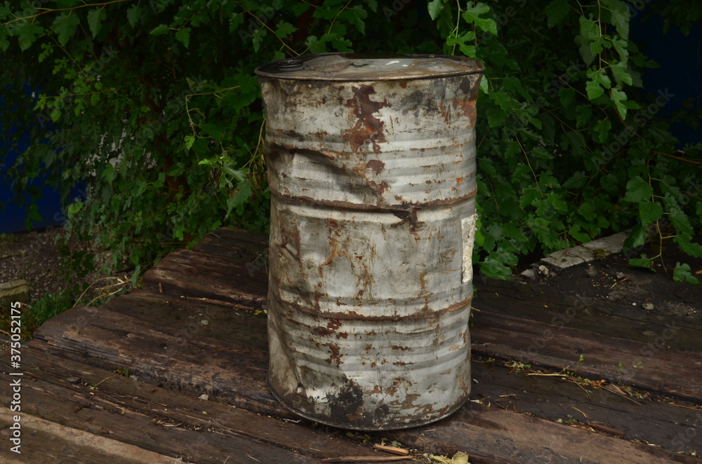 A large gray barrel in the village.
