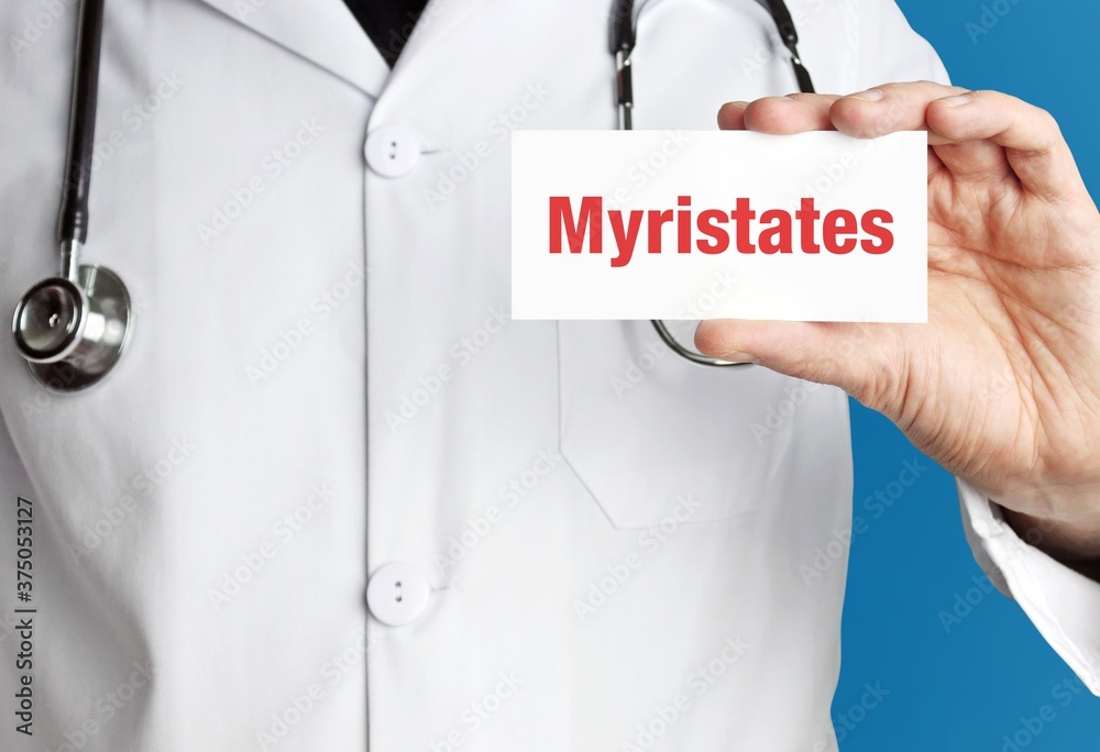 Myristates. Doctor holds a business card in his hand. Text is on the sign. Close up. Myristates. Doctor holds a business card in his hand. Text is on the sign. Close up.