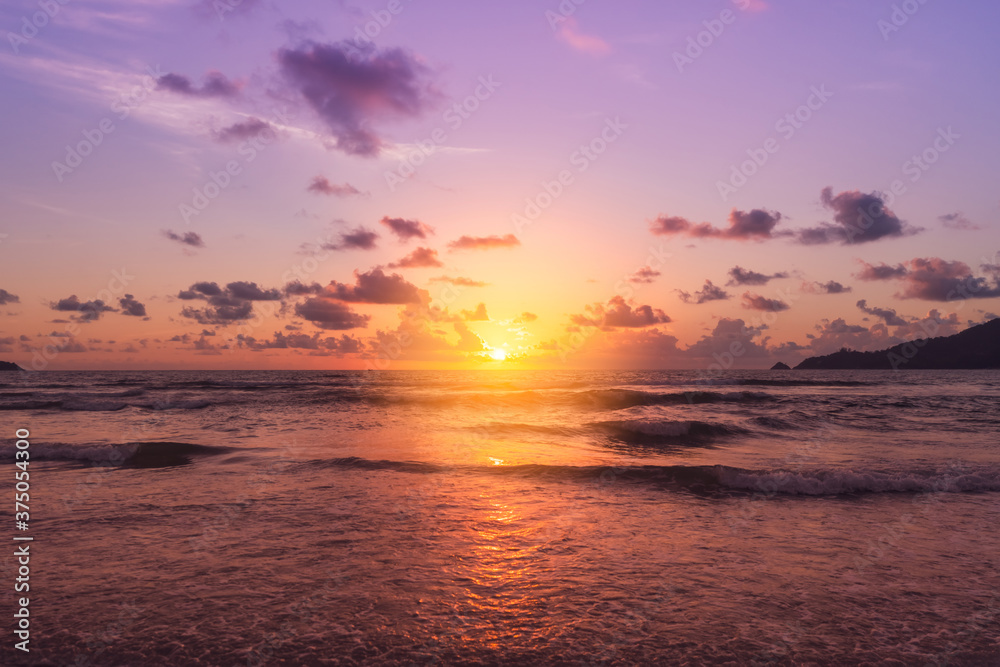 Tropical nature sea or beach in summer time with sunrise or sunset with light flare.