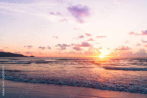 Tropical nature sea or beach in summer time with sunrise or sunset with light flare.