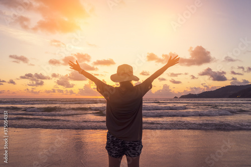 Woman rise hands up to sky freedom concept with blue sky.