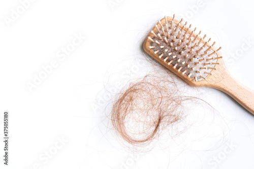 Fotografía Top view of a brush with lost hair on it, hair fall everyday serious problem