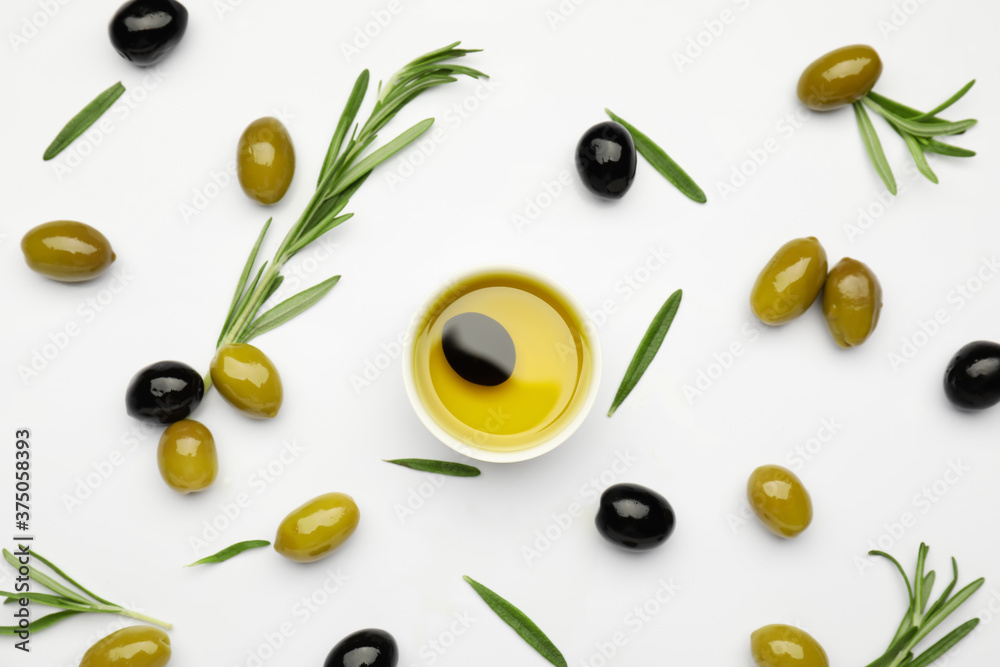 Composition with bowl of olive oil on white background Composition with bowl of olive oil on white background