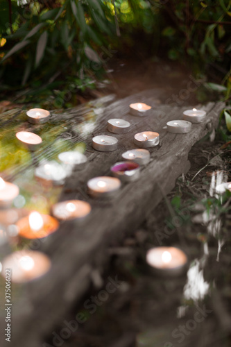 Candles on a dark background with reflection
